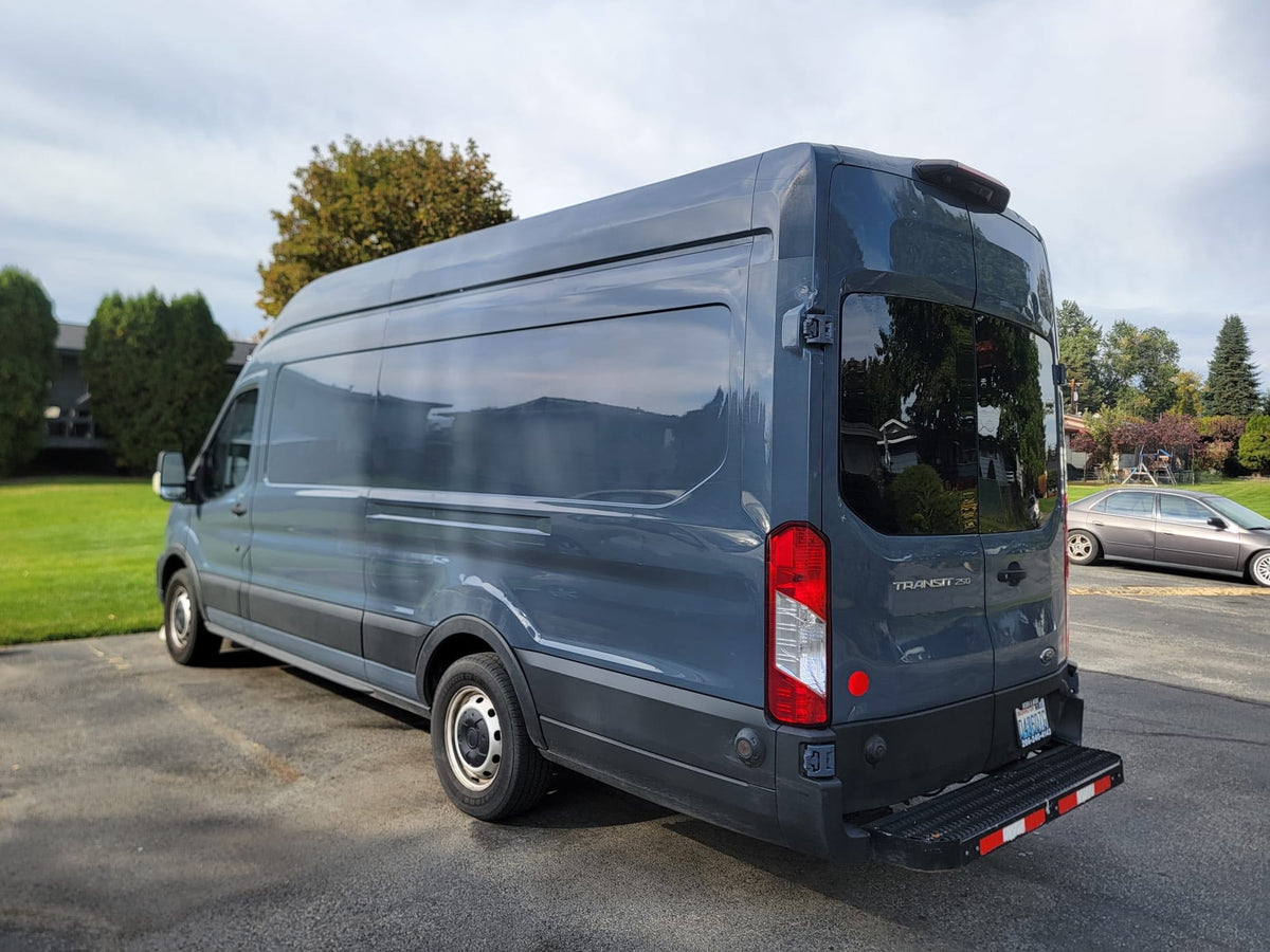  perfect for your next rv rental adventure.|Dark grey Ford Transit 250 high-roof van — photo 2