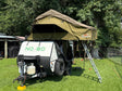 Explore the outdoors with this RV rental! A "No Boundaries" teardrop camper features a 23ZERO rooftop tent