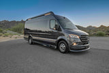 Dark gray Mercedes-Benz Sprinter luxury van, perfect for RV rental adventures in a scenic desert mountain landscape.