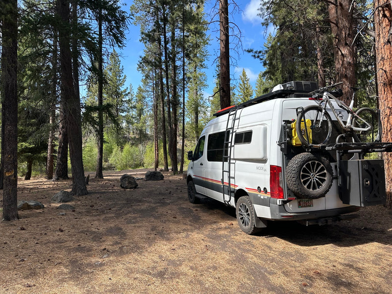  parked under blue skies.|Explore nature with this rugged white Storyteller camper van — photo 4