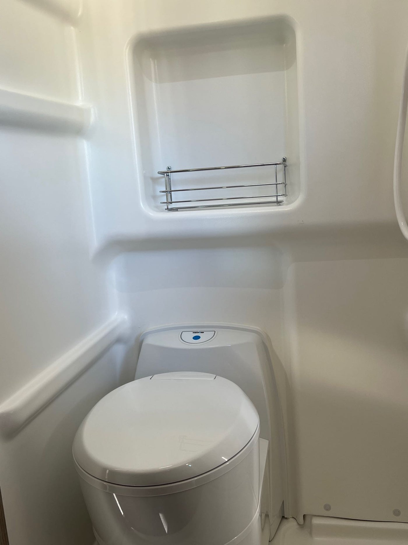  features open doors and an extended roof for adventure.|A white Winnebago camper van — photo 6