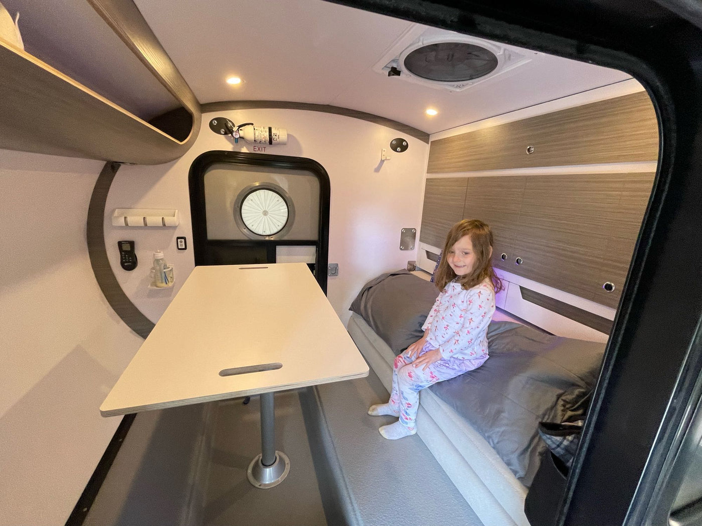 and modern finishes.|Inside an RV rental: Modern overhead storage cabinets — photo 12