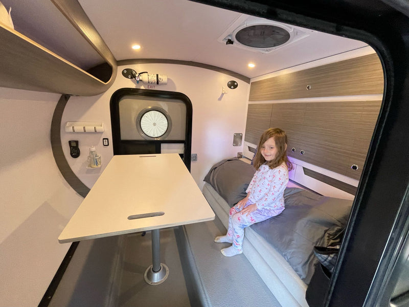  and modern finishes.|Inside an RV rental: Modern overhead storage cabinets — photo 12