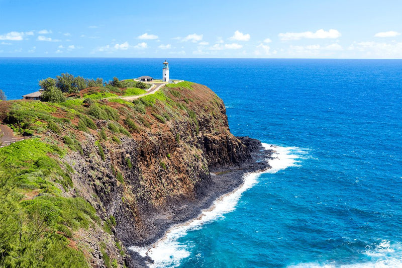 Kilauea Lighthouse atop a lush cliff overlooking Hawaii's blue ocean. Experience island beauty with an RV rental. — photo 20