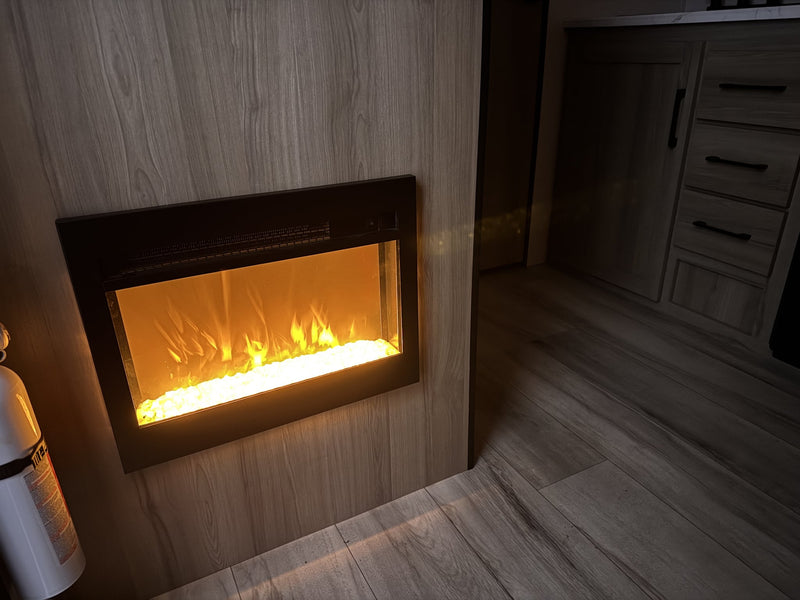  is parked on a driveway under a cloudy sky.|RV rental interior featuring cozy bunk beds — photo 6