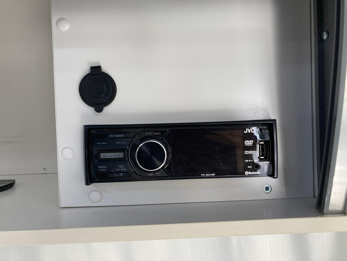 An RV rental's built-in JVC stereo provides entertainment with DVD, USB, and Bluetooth connectivity, plus an extra USB port.