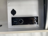 An RV rental's built-in JVC stereo provides entertainment with DVD, USB, and Bluetooth connectivity, plus an extra USB port.