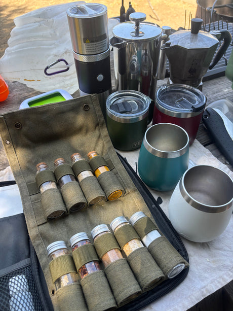 RV rental ready: Portable coffee grinder, French press, Moka pot, insulated mugs, and a roll-up spice kit for camping.