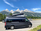 Experience an rv rental with stunning mountain views! This camper van is perfect for national park adventures.