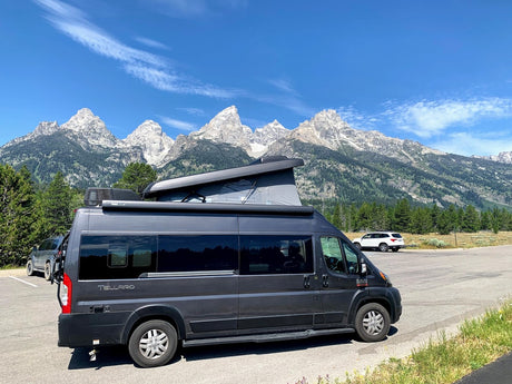 Experience an rv rental with stunning mountain views! This camper van is perfect for national park adventures.