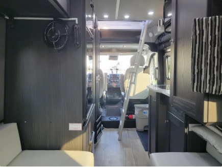  and rear lounge area in daytime setup.|Inside a modern rv rental — photo 15