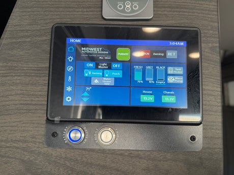RV rental's smart control panel shows water tank levels, battery status, temperature, and appliance controls.