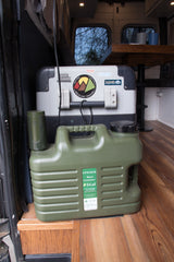 RV rental with camping essentials: a large cooler, 5-gallon water container, and gear for national park adventures.