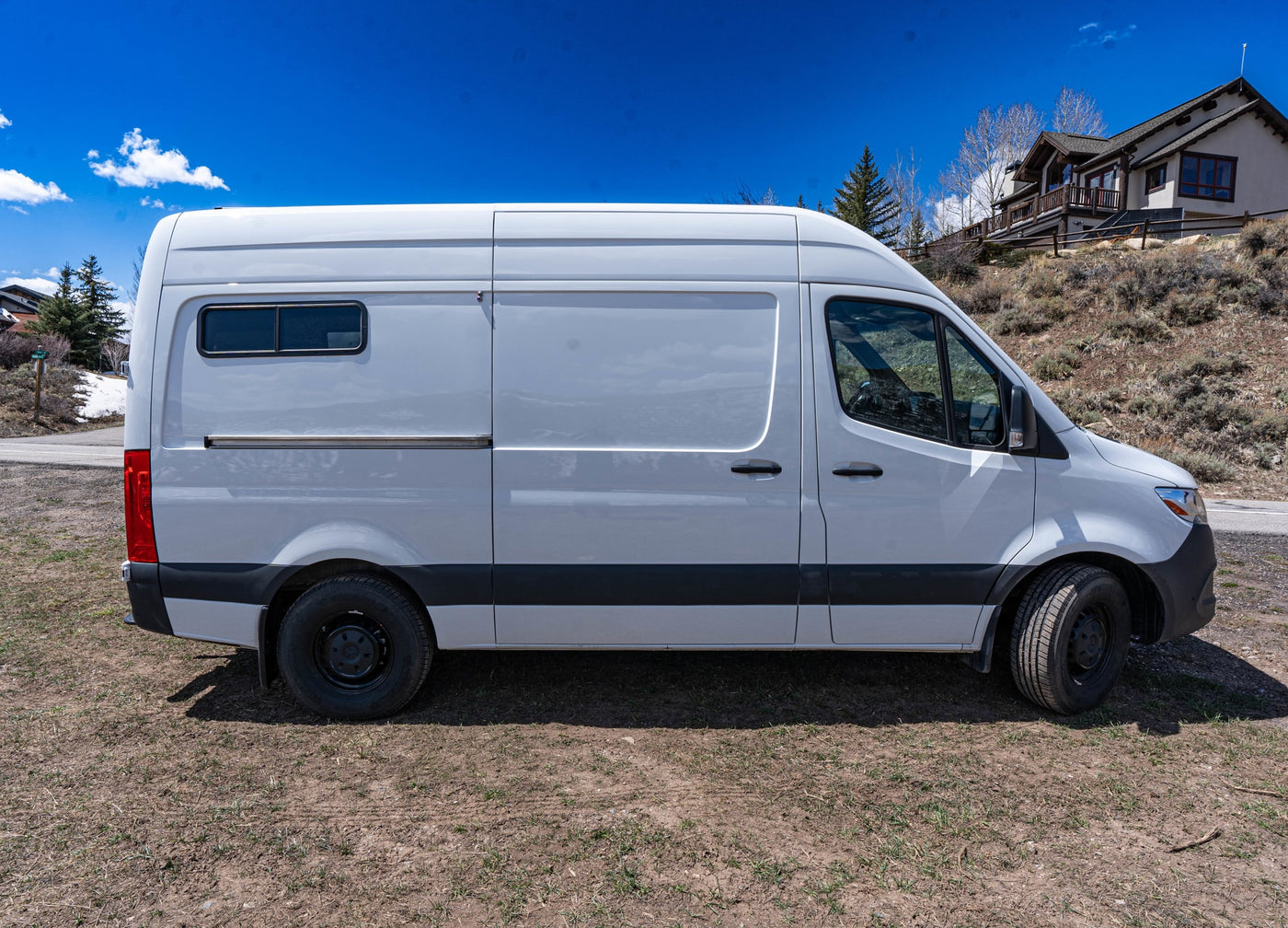  illuminated by a brilliant sun flare.|Sunset van life: An RV rental parked in desert at dusk — photo 9