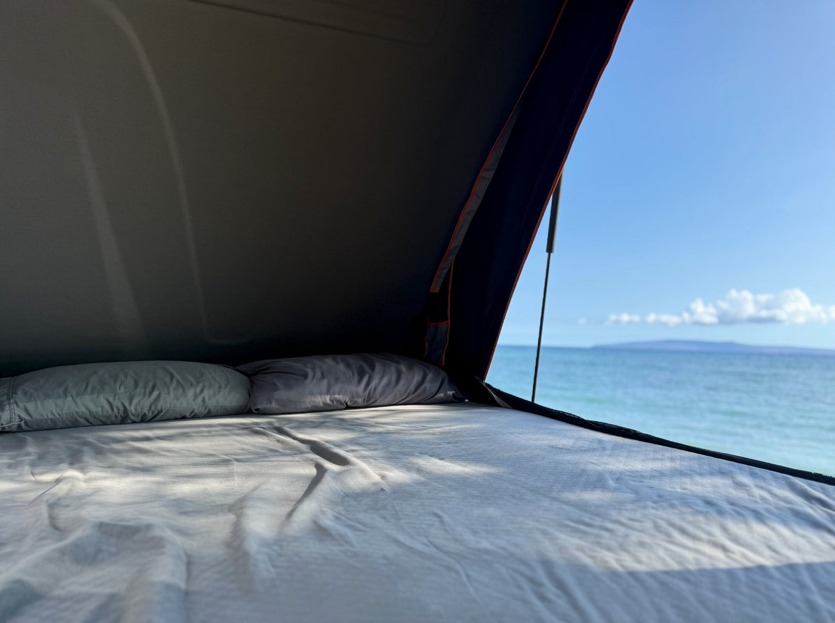 Serene ocean view from a comfy bed in an RV rental rooftop tent. Enjoying beach camping with this incredible vista. — photo 7