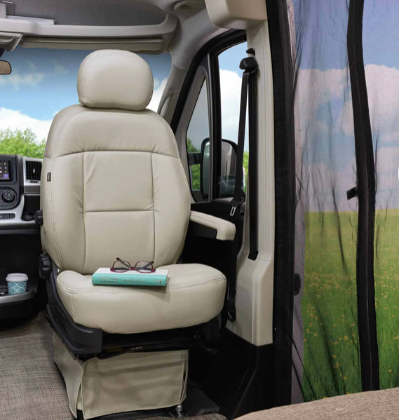 Comfortable, swiveling passenger seat in an RV rental, with a scenic view of nature through the screened entry. — photo 14