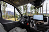 Spacious RV rental interior with a large touchscreen display, showcasing a mountain and forest view, ideal for a road trip.