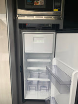 Essential RV rental appliances: an open Norcold refrigerator and microwave, ready for your road trip meals.