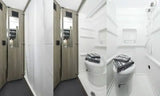 This RV rental features a compact bathroom with a shower, toilet, built-in shelving, and fresh towels.
