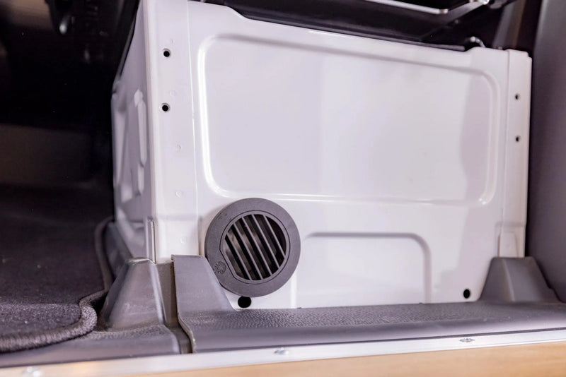  ready for mountain adventures.|White rv rental van with open doors displaying interior bed/storage — photo 2