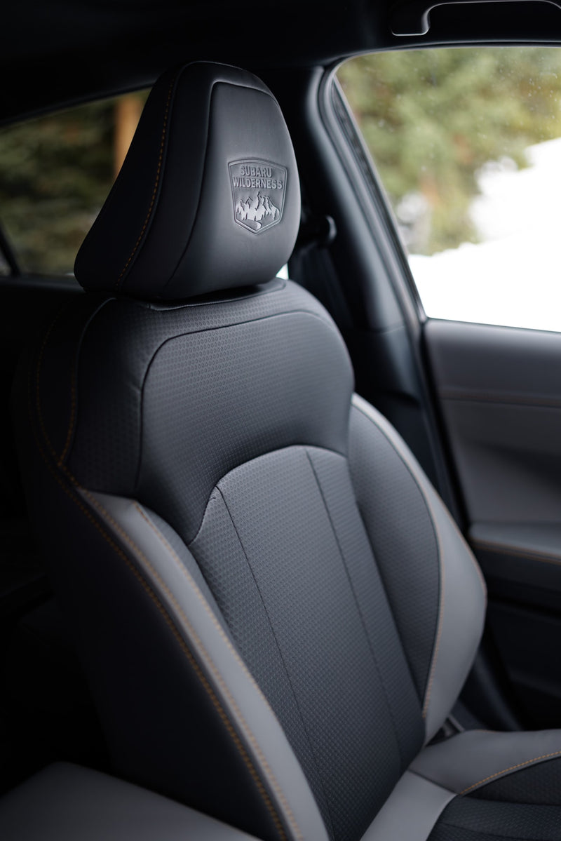 Subaru Wilderness car seat, detailed headrest logo & orange stitching. Premium interior comfort for your next RV rental adventure. — photo 13