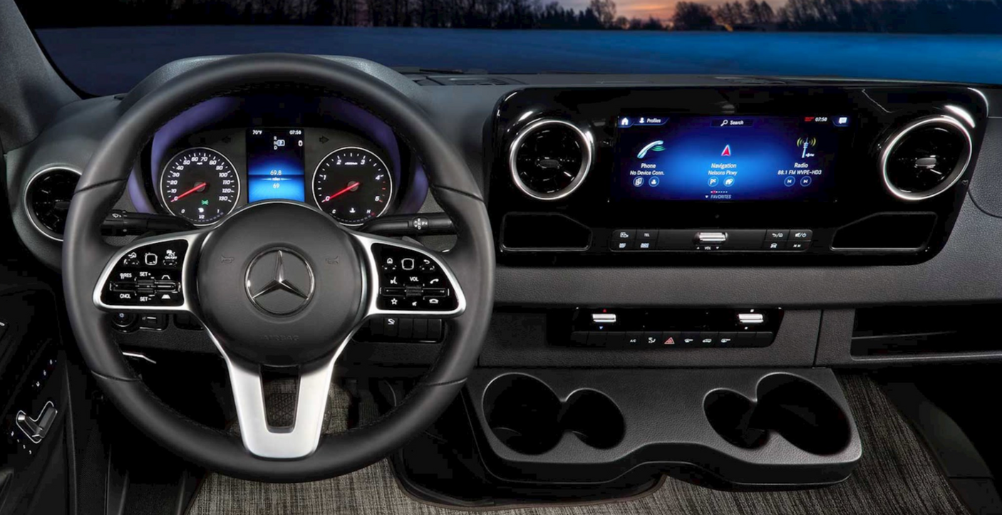 Experience comfort in your RV rental with this Mercedes-Benz Sprinter van interior, featuring a modern dashboard & infotainment.