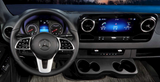 Experience comfort in your RV rental with this Mercedes-Benz Sprinter van interior, featuring a modern dashboard & infotainment.