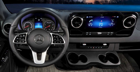 Experience comfort in your RV rental with this Mercedes-Benz Sprinter van interior, featuring a modern dashboard & infotainment.