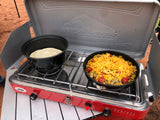 Delicious outdoor breakfast cooked on a Camp Chef camping stove with cheesy skillet and tortillas, ideal for your RV rental journey.
