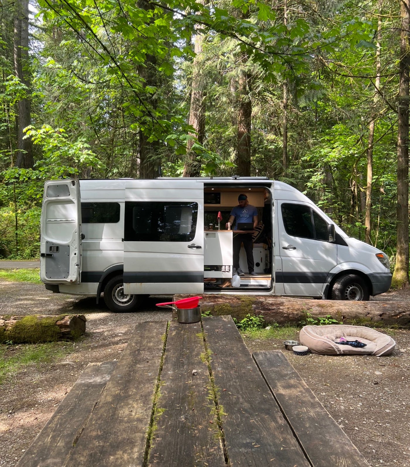  and wood ceiling.|Compact RV rental wet bath featuring a shower — photo 19