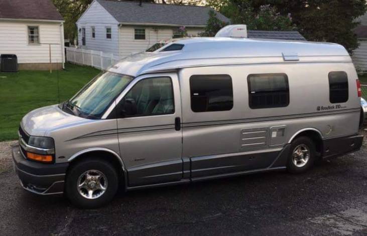 Explore in comfort with this silver Roadtrek 210 camper van — photo 1