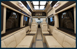 This RV rental offers a luxurious and spacious interior with cream leather seating, TV, and ample room for comfortable travel.