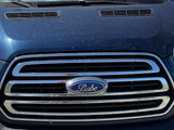 Dusty blue van front with a "Babe" emblem on its chrome grille, perfect for an rv rental road trip.