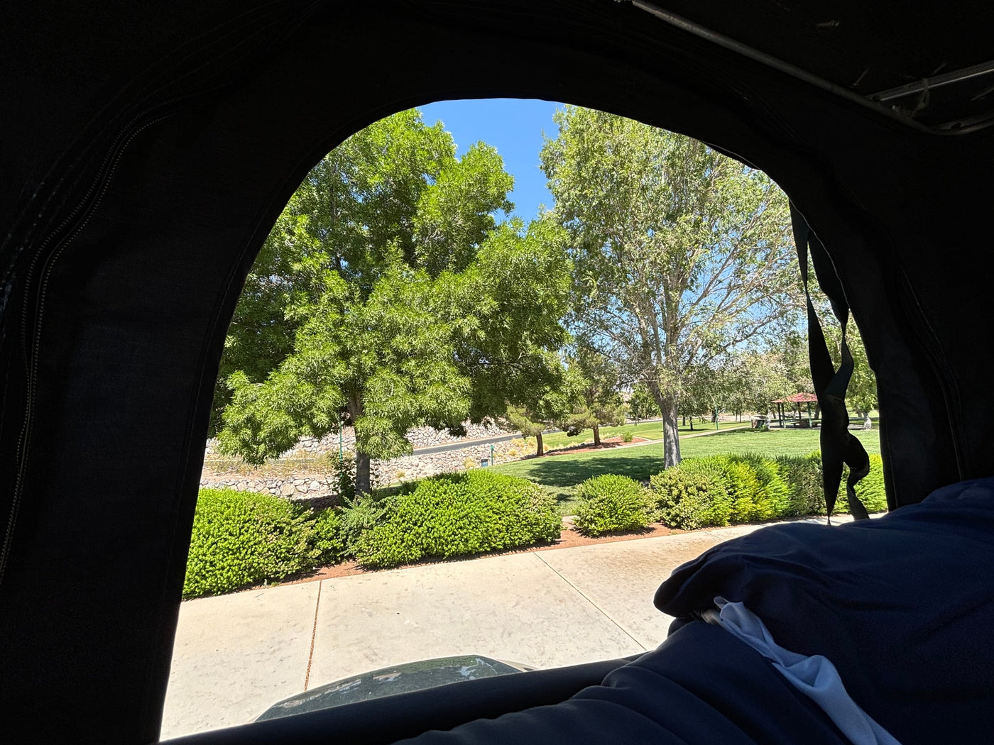  ready for road trips or an RV rental adventure. Spacious and comfortable view.|Cozy RV rental rooftop tent interior: dark fabric — photo 5