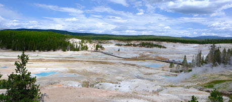 Discover Yellowstone's active geothermal basin with its boardwalk, colorful pools, and steam. A perfect RV rental destination!