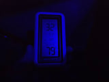 This RV rental's thermometer glows blue, showing 32°F outside and a warm 79°F inside. Cozy comfort on the road.