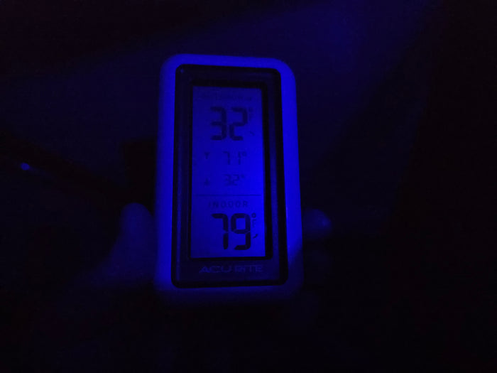 This RV rental's thermometer glows blue, showing 32°F outside and a warm 79°F inside. Cozy comfort on the road.