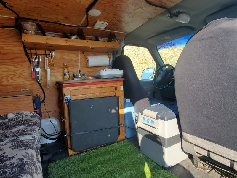  and compact kitchen area featuring a sink.|Cozy RV rental interior showing a kitchenette with a sink — photo 6