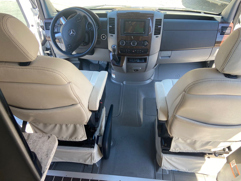  and comfortable seating. Ideal for your next adventure.|Inside an RV rental: a well-appointed kitchen with sink and two-burner stove — photo 7