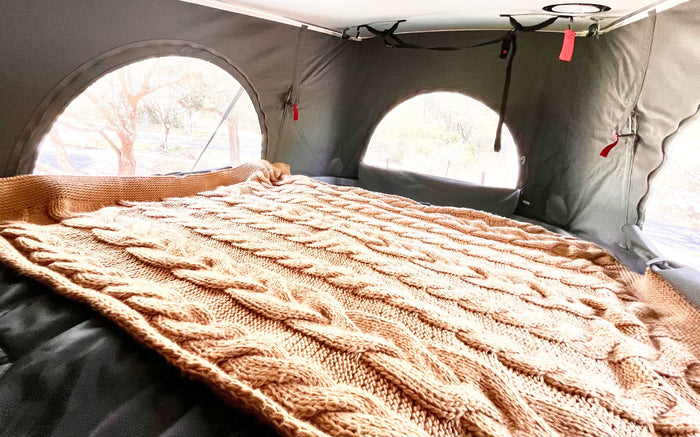  and bright window for travel.|RV rental: Relaxing inside a pop-top camper