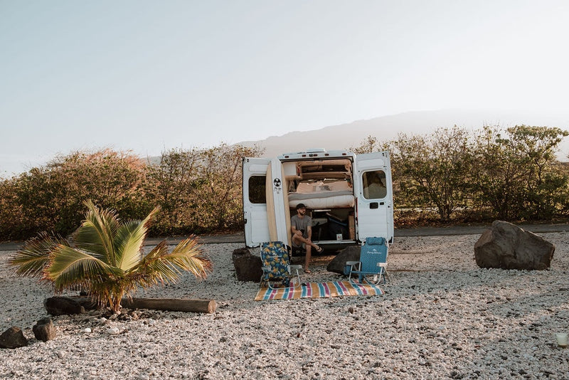  and a manta ray lining.|Sustainable living in an RV rental: a clean Separett composting toilet with wood accents. Ideal for compact off-grid travel.|Inside an RV rental's portable refrigerator — photo 19