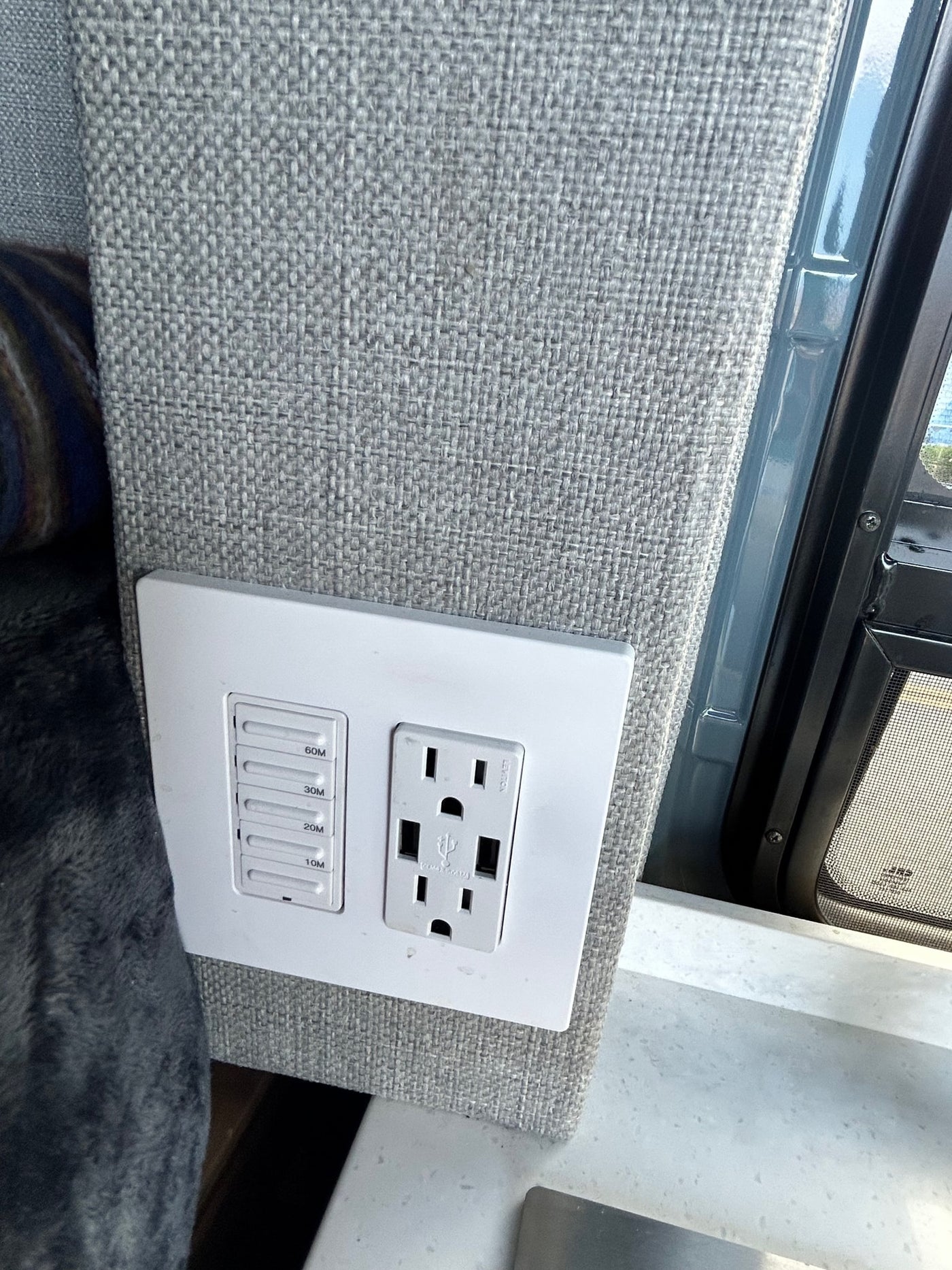  and a clear road ahead.|Open mini-fridge with freezer and shelves inside an RV rental camper van — photo 8