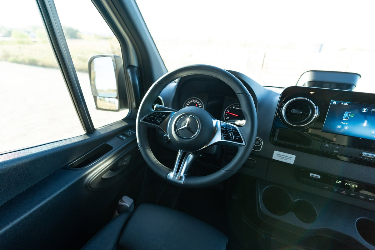 Mercedes-Benz Sprinter RV rental interior: steering wheel, dashboard, and infotainment system are visible. — photo 16