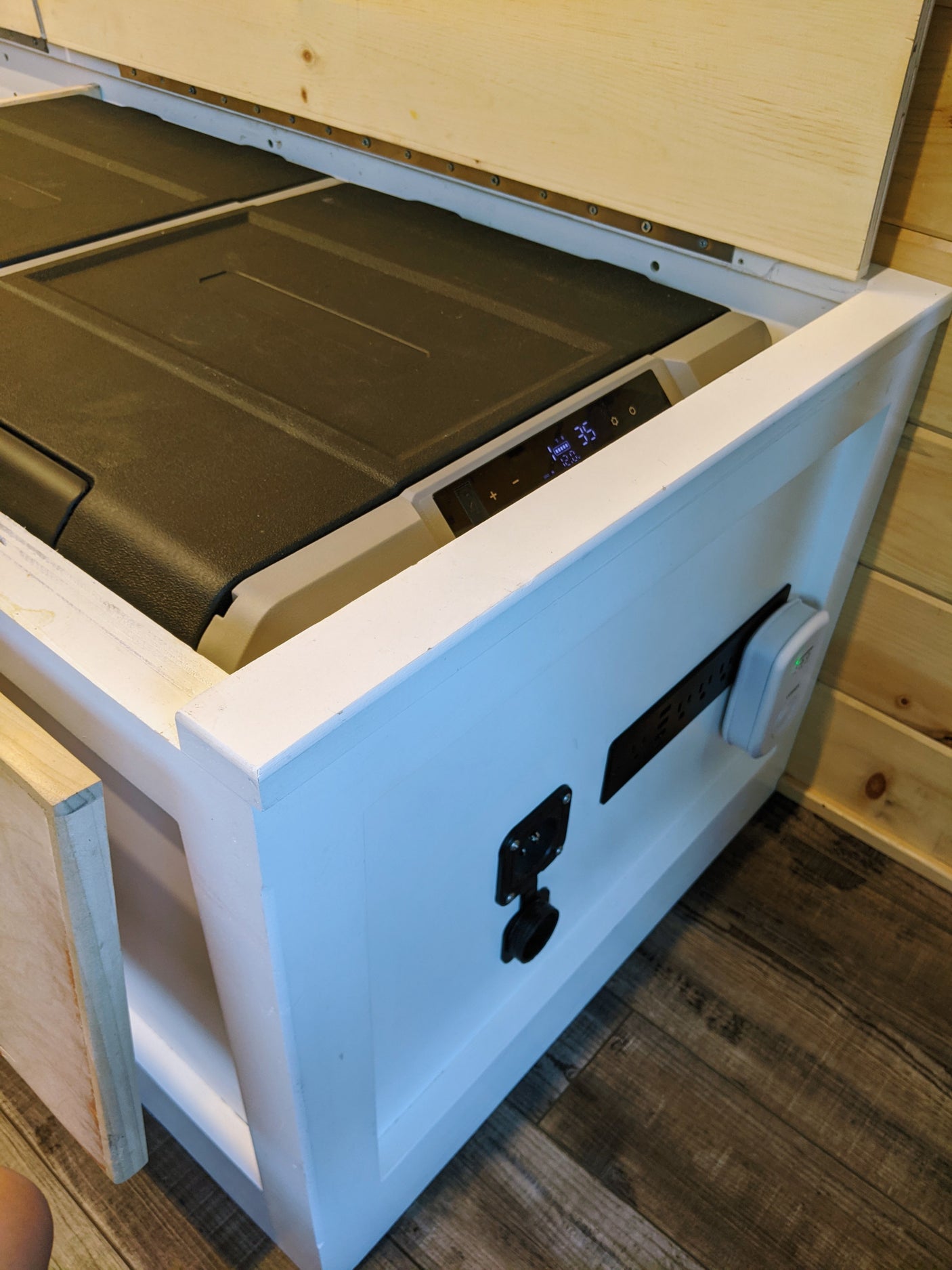 RV rental comfort: A built-in cooler and power station in a custom cabinet provide convenience on the go.