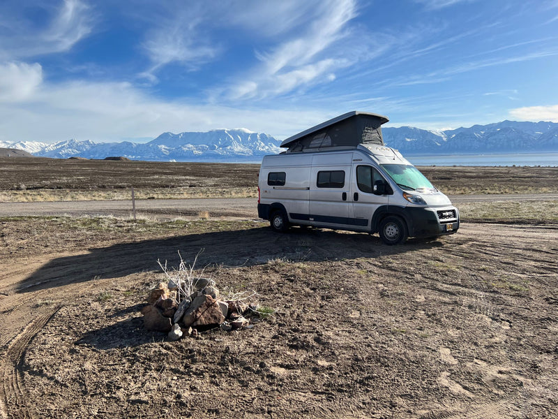  and dish soap for convenient road trip cooking.|Inside an RV rental: a pristine white bathroom with a modern toilet — photo 17