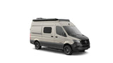 Off-road Mercedes-Benz Sprinter camper van in beige/black, with awning and light bar, ideal for rv rental.