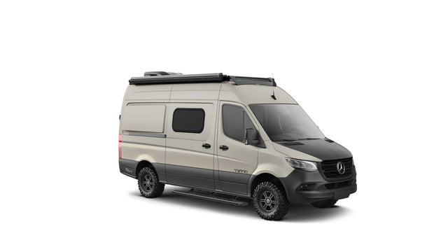Off-road Mercedes-Benz Sprinter camper van in beige/black, with awning and light bar, ideal for rv rental.