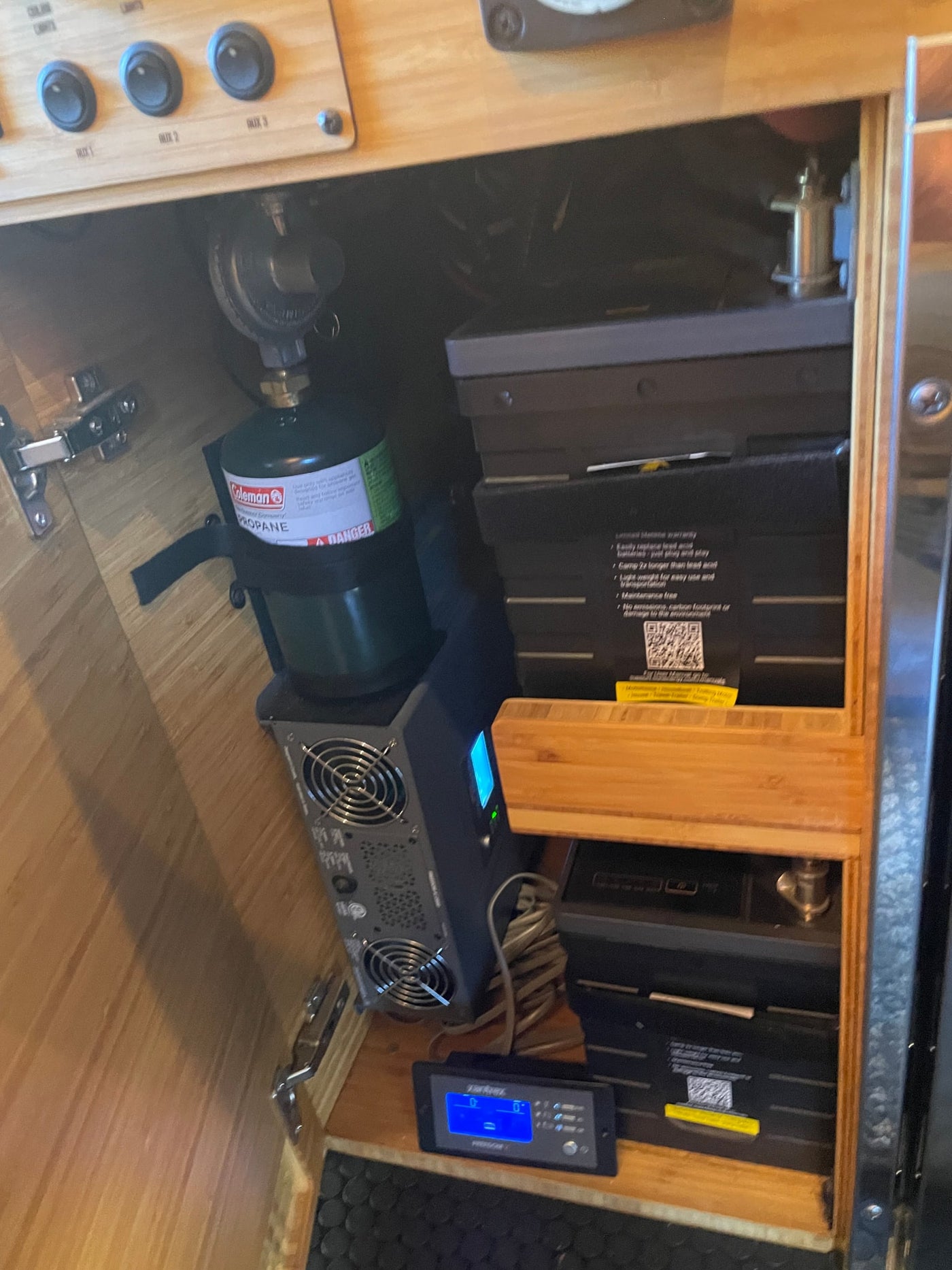 RV rental: Essential systems include Coleman propane, power inverter, lithium batteries, & main control panel for power management. — photo 8