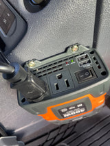 A close-up shows a 400W power inverter mounted in an RV rental, with AC outlet and USB ports for mobile charging.