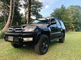 Black Toyota 4Runner 4x4 SUV (Hawaii plate KFR 245) on grass. A versatile option for outdoor trips, similar to an RV rental.